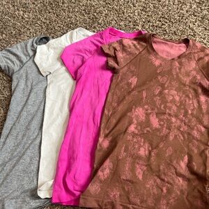 Set of Four lululemon swiftly techs in Gray, White, Pink, and Brown